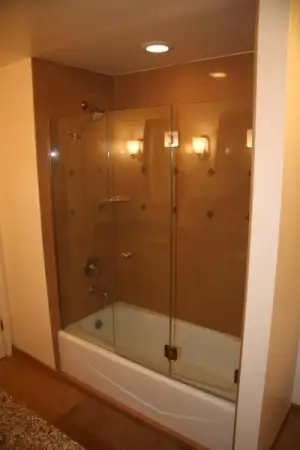 photo of a bathtub/shower combo with new tile