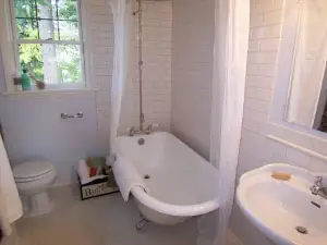 photo of a completed bathroom with a claw-foot tub