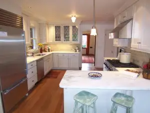 photo of a kitchen remodel with new counters and floors but from another angle
