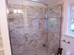 photo of a shower with intricate tile work