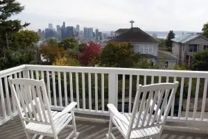 photo of a deck and chairs overlooking the Seattle skyline