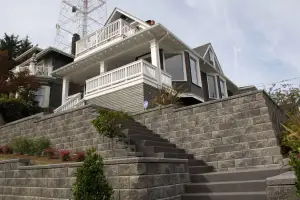 photo of a house with a brand new rockery update and driveway in Seattle