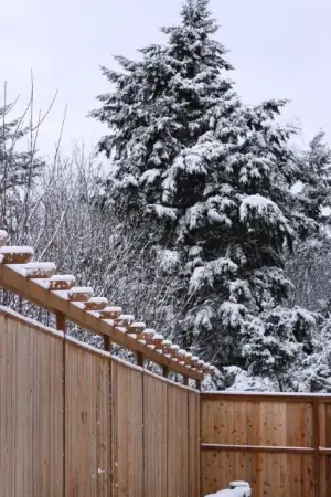 photo of a fence that we completed in the snow